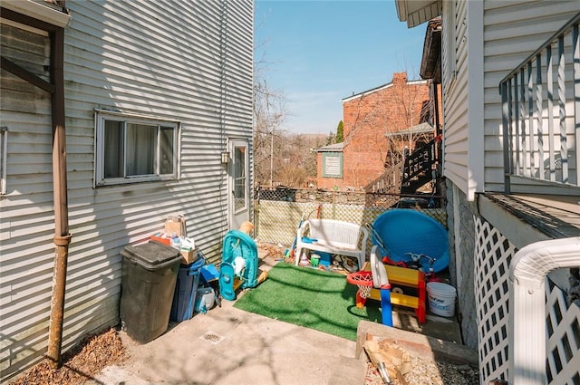 view of patio featuring fence