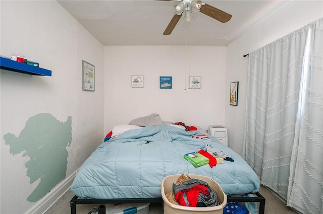 bedroom with baseboards, ceiling fan, and carpet flooring