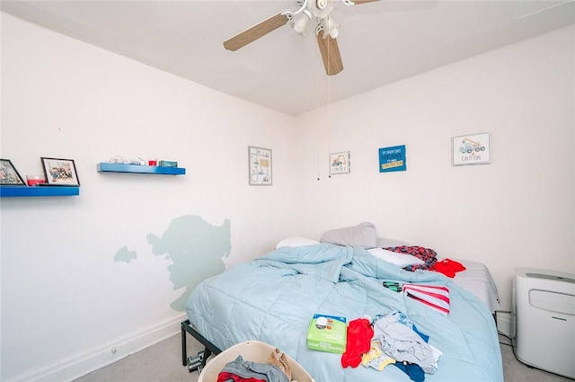 carpeted bedroom with baseboards and ceiling fan