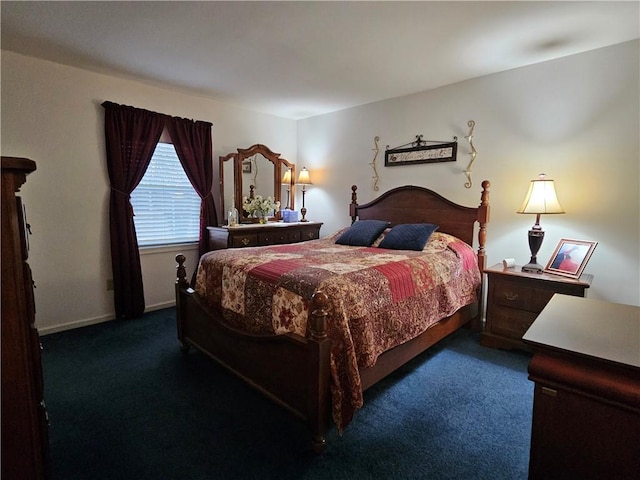 bedroom featuring baseboards and carpet floors