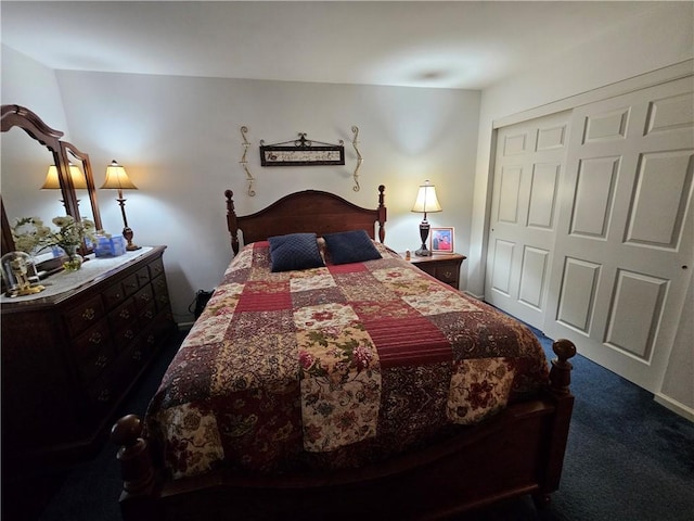 bedroom with dark colored carpet and a closet