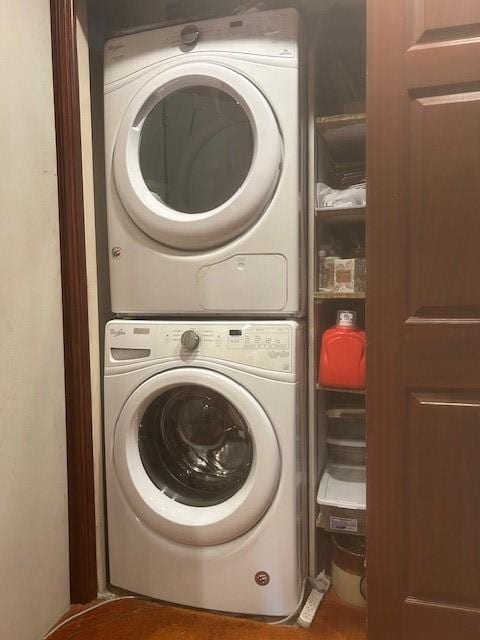 laundry room featuring laundry area and stacked washer / drying machine