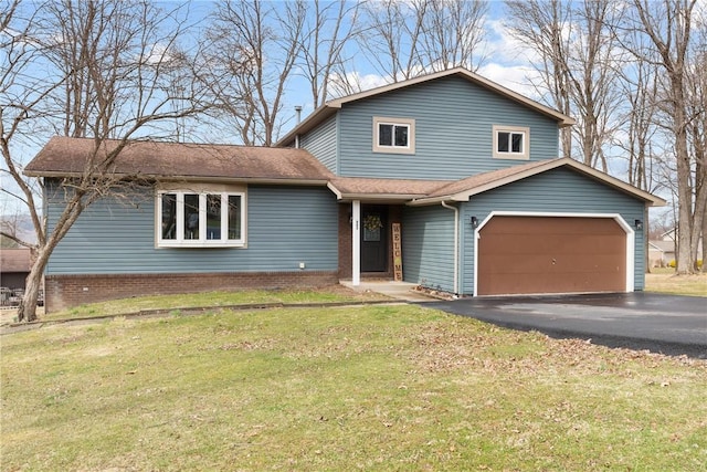 view of front of home with a garage, a front yard, roof with shingles, and driveway