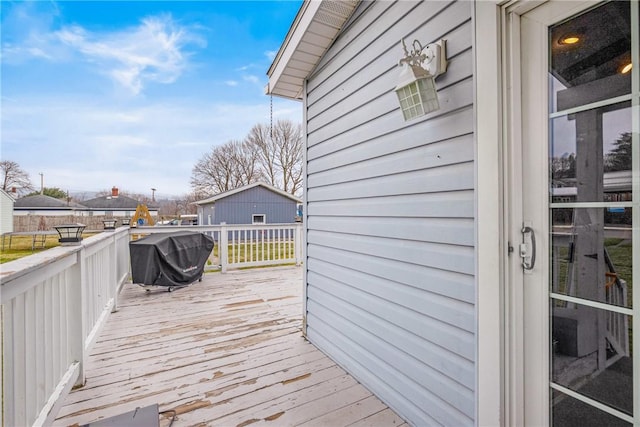 wooden deck featuring area for grilling