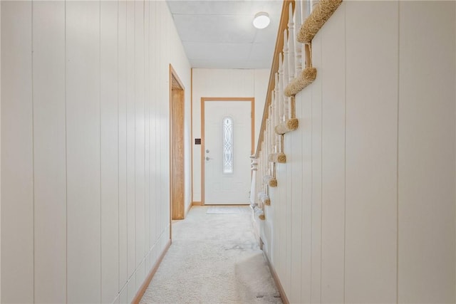 hallway featuring light carpet