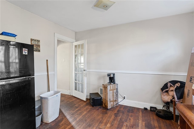 kitchen with hardwood / wood-style floors, french doors, baseboards, and freestanding refrigerator