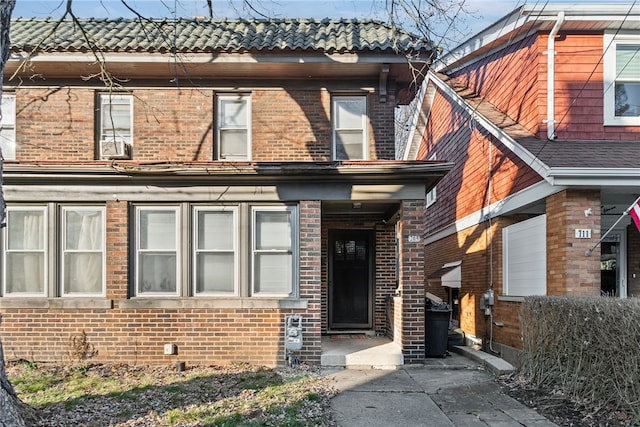 view of front of property featuring brick siding