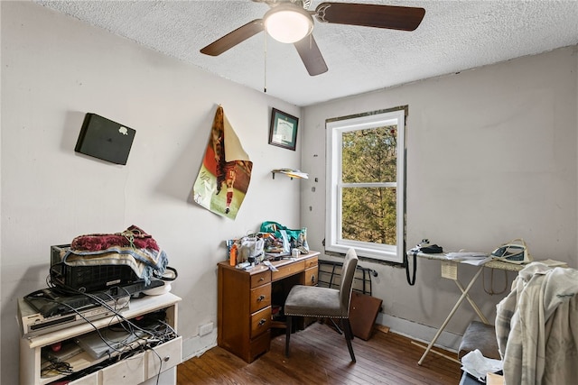 office area with a textured ceiling, ceiling fan, and hardwood / wood-style floors