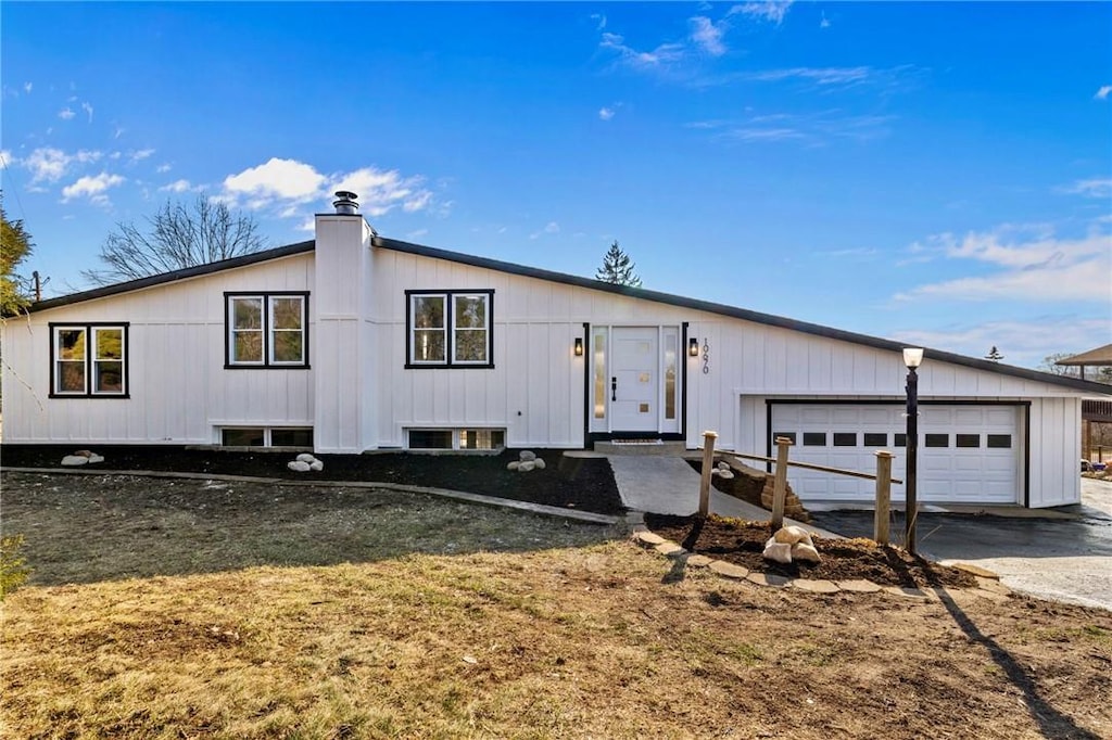 10670 Farview Dr, North Huntingdon, PA 15642 - view of front of house featuring concrete driveway and a garage