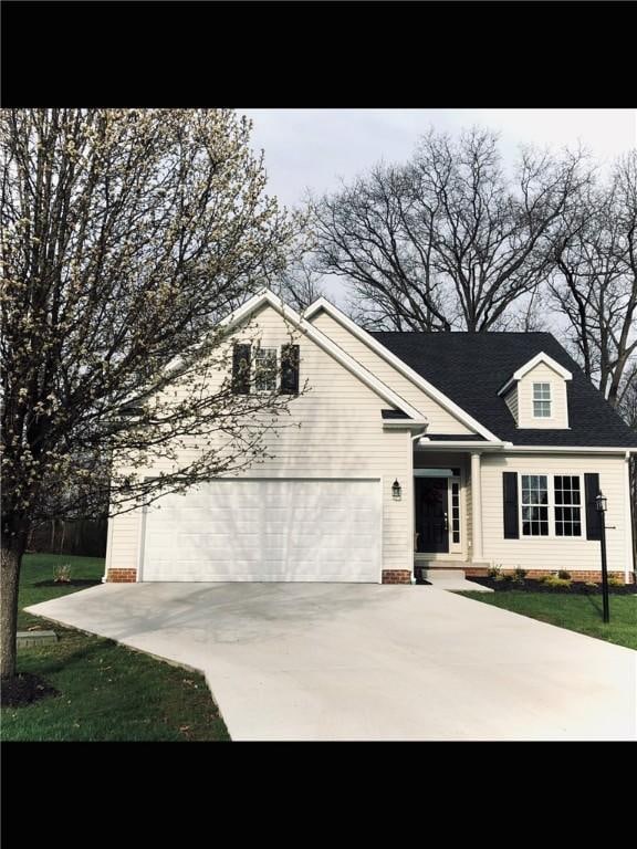 view of front of property featuring concrete driveway, a garage, and crawl space