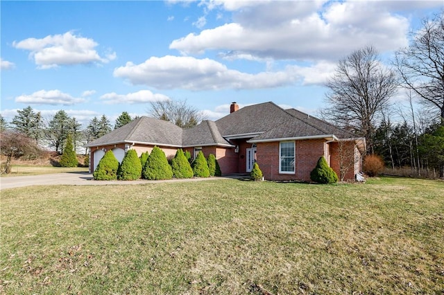 single story home featuring a front lawn, concrete driveway, brick siding, and a chimney