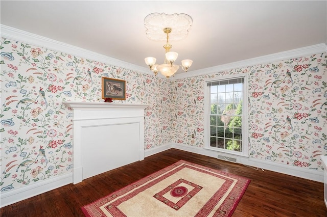 dining room featuring visible vents, a chandelier, dark wood finished floors, and wallpapered walls