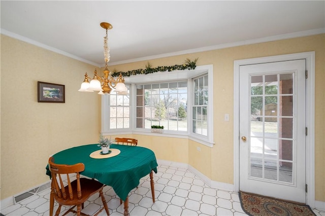 dining area featuring tile patterned floors, plenty of natural light, an inviting chandelier, and crown molding