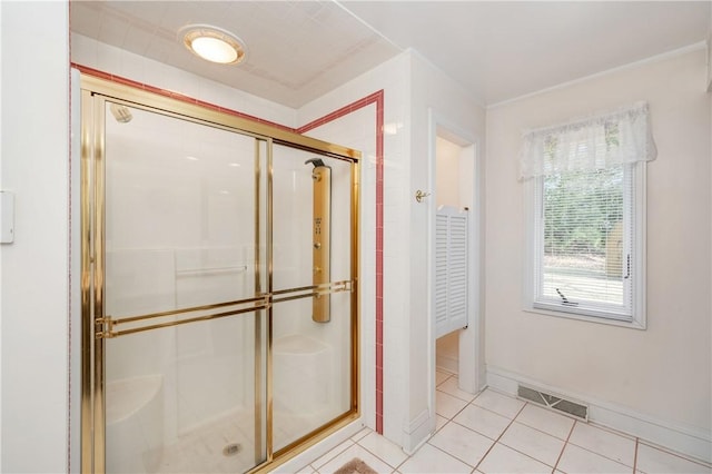 full bath featuring visible vents, baseboards, a shower stall, and tile patterned flooring