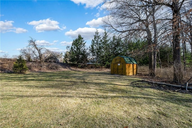 view of yard featuring an outbuilding and a shed