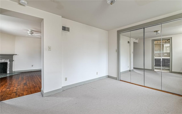 unfurnished bedroom with baseboards, visible vents, and carpet floors