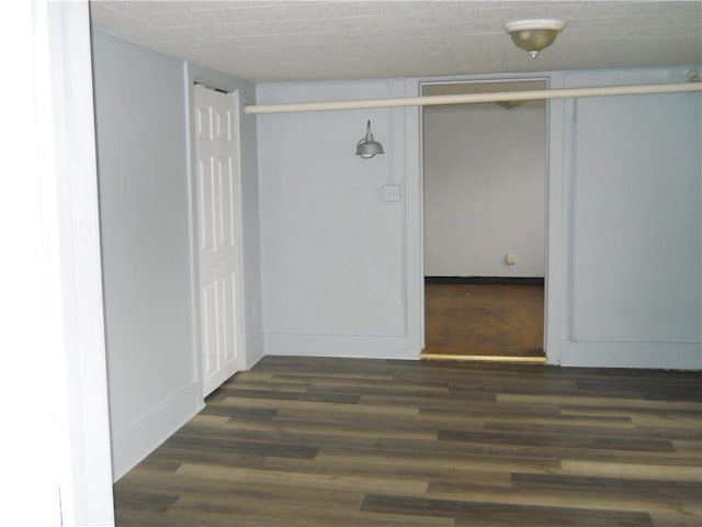 empty room featuring wood finished floors