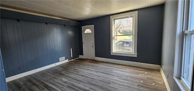 entrance foyer with visible vents, baseboards, and wood finished floors