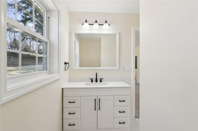 bathroom with vanity and a healthy amount of sunlight