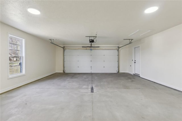garage featuring baseboards and a garage door opener