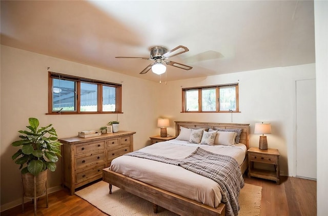 bedroom featuring wood finished floors and ceiling fan
