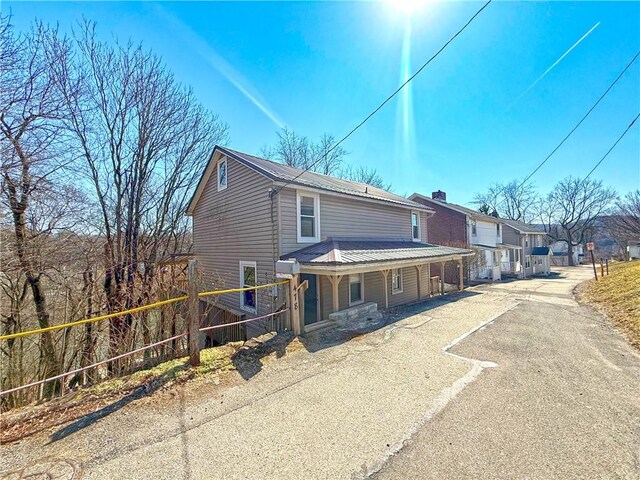 478 Spang Ave, Leechburg Boro, PA 15656 - view of front of home with driveway and metal roof