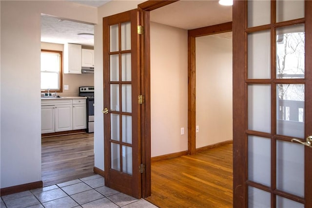 478 Spang Ave, Leechburg Boro, PA 15656 - hall with a sink, french doors, baseboards, and light wood finished floors