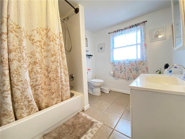 bathroom featuring vanity, shower / tub combo, toilet, baseboards, and tile patterned floors