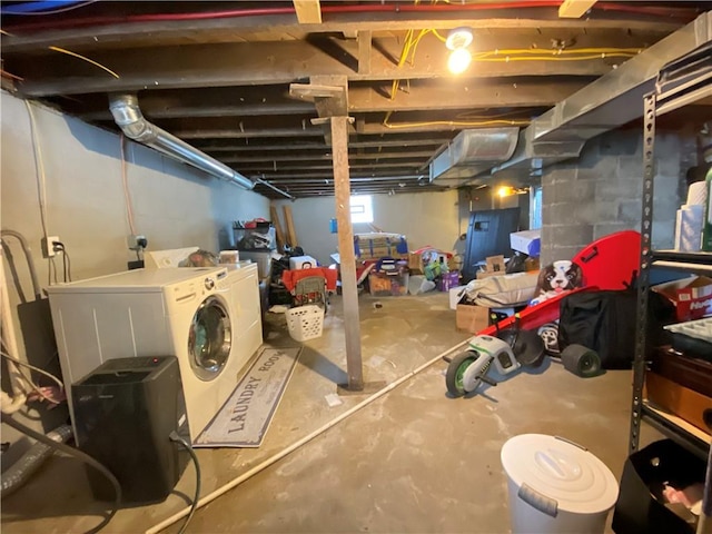 below grade area with washing machine and dryer