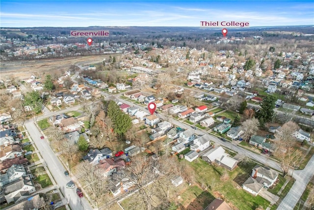 birds eye view of property with a residential view