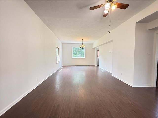 9 E Ridge Ave, Greenville Boro Mer, PA 16125 - spare room featuring a chandelier, dark wood-type flooring, a ceiling fan, baseboards, and a textured ceiling