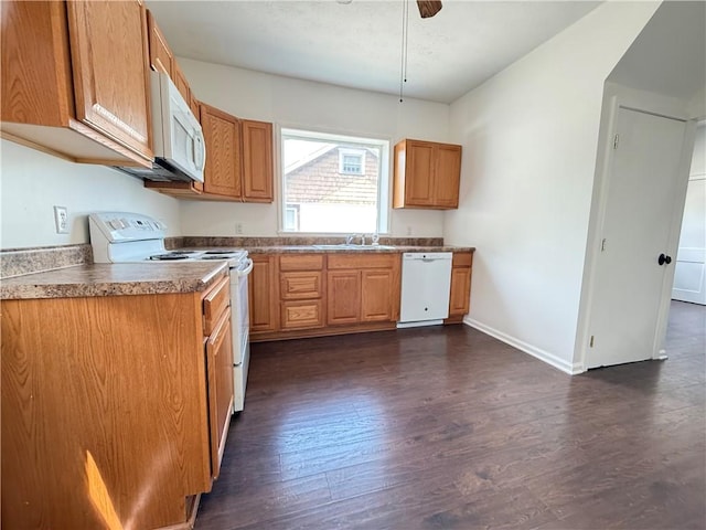 9 E Ridge Ave, Greenville Boro Mer, PA 16125 - kitchen with white appliances, dark wood finished floors, baseboards, and a sink