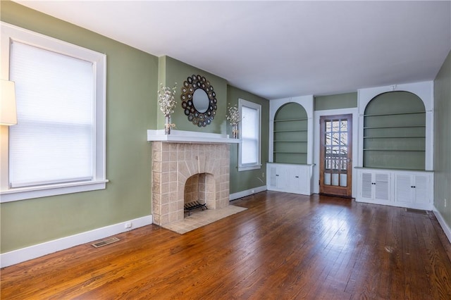 3361 Portola Ave, Observatory Hill, PA 15214 - unfurnished living room featuring wood-type flooring, a fireplace, and built in features