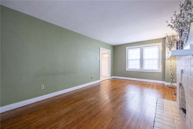 3361 Portola Ave, Observatory Hill, PA 15214 - unfurnished living room with a tile fireplace and wood-type flooring