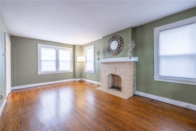3361 Portola Ave, Observatory Hill, PA 15214 - unfurnished living room with wood-type flooring and a fireplace