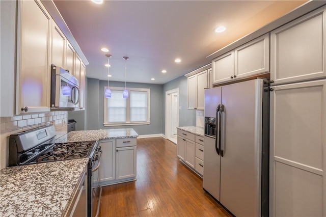 3361 Portola Ave, Observatory Hill, PA 15214 - kitchen featuring appliances with stainless steel finishes, tasteful backsplash, dark wood-style flooring, light stone countertops, and recessed lighting