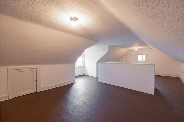 3361 Portola Ave, Observatory Hill, PA 15214 - bonus room with a textured ceiling, dark wood-type flooring, and lofted ceiling