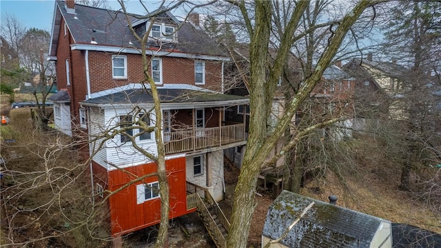 3361 Portola Ave, Observatory Hill, PA 15214 - back of house with a chimney, a balcony, brick siding, and a shingled roof