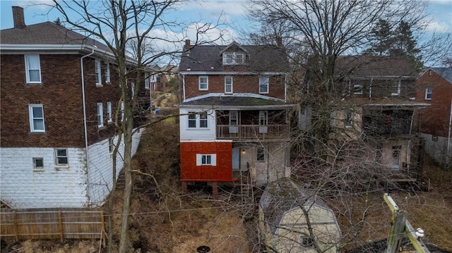3361 Portola Ave, Observatory Hill, PA 15214 - back of house with brick siding, a chimney, and a balcony