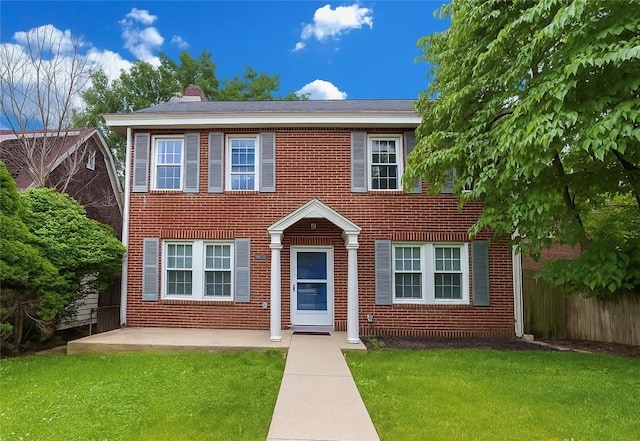 3361 Portola Ave, Observatory Hill, PA 15214 - colonial home featuring brick siding, a chimney, and a patio