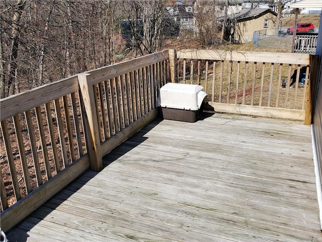 wooden deck with a grill