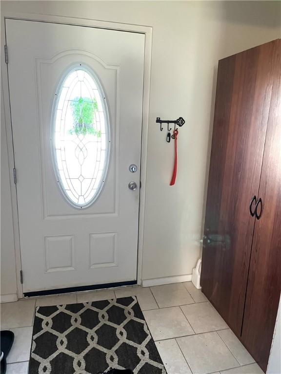 310 Church St, Harrisville Boro, PA 16038 - foyer with light tile patterned floors