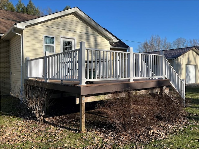 310 Church St, Harrisville Boro, PA 16038 - rear view of house with a deck, roof with shingles, and brick siding