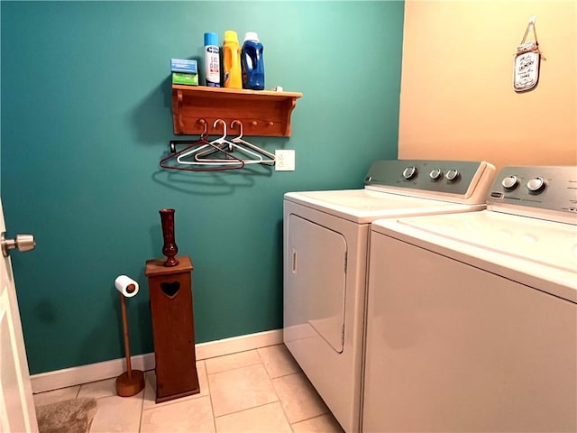 310 Church St, Harrisville Boro, PA 16038 - washroom featuring separate washer and dryer, light tile patterned floors, and baseboards
