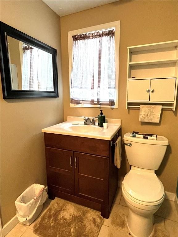 310 Church St, Harrisville Boro, PA 16038 - bathroom featuring vanity, toilet, baseboards, and tile patterned floors