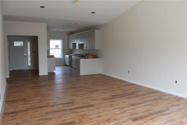 330 Cherokee Dr, Chippewa Twp, PA 15010 - unfurnished living room featuring wood finished floors and baseboards