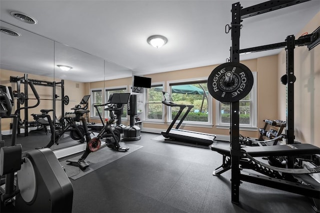 workout area with visible vents and baseboards
