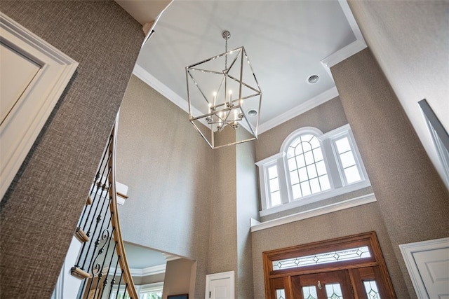 details featuring a notable chandelier and ornamental molding