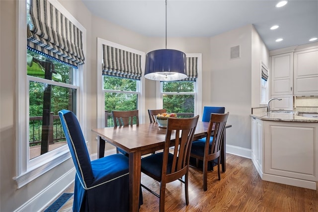 dining area with recessed lighting, wood finished floors, visible vents, and baseboards
