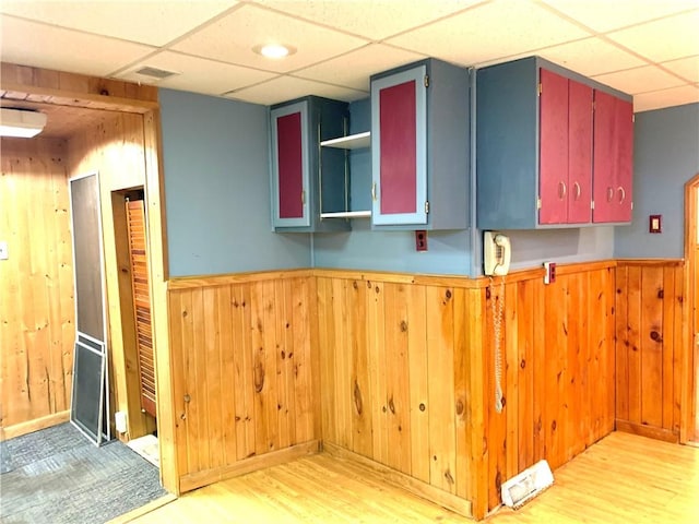 406 Peach St, City Of But Ne, PA 16001 - kitchen featuring a paneled ceiling, wooden walls, light wood-type flooring, wainscoting, and open shelves